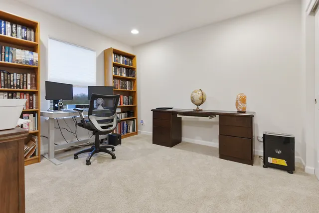 a view of a workspace with furniture