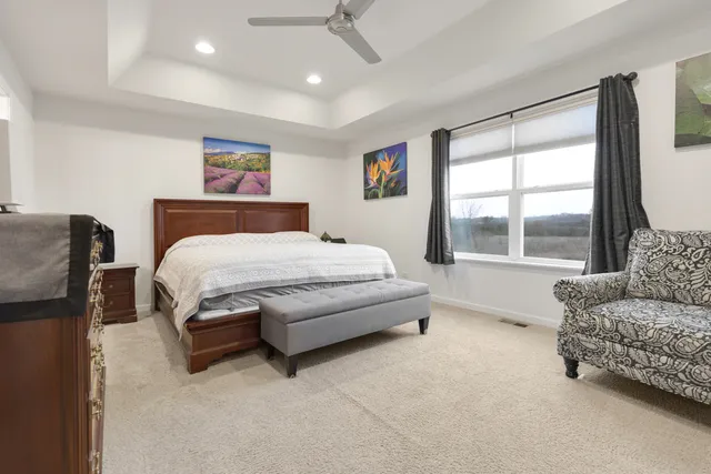 a bedroom with a bed and a couch