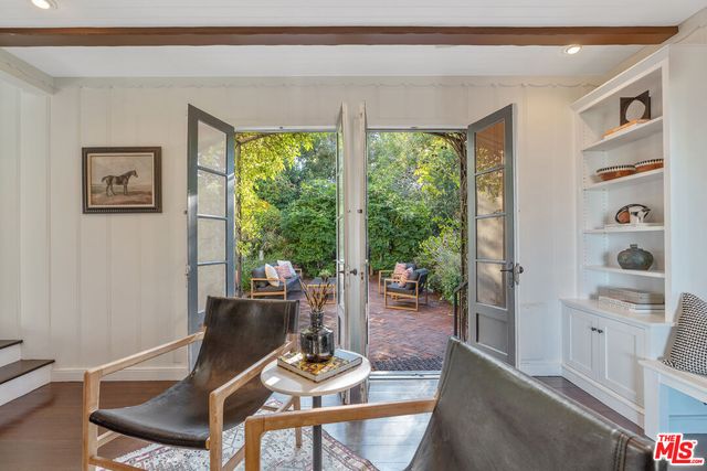 a bedroom with furniture and window