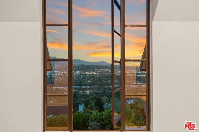 a bathroom with a granite countertop tub sink and mirror