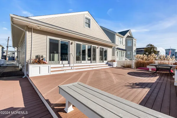 a large kitchen with a table and chairs