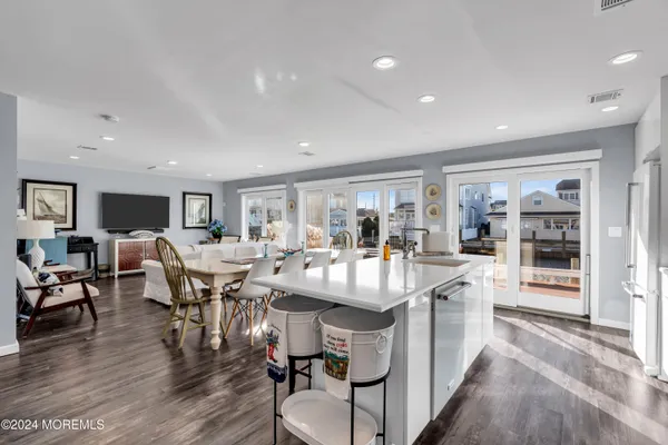 a large kitchen with a table and chairs