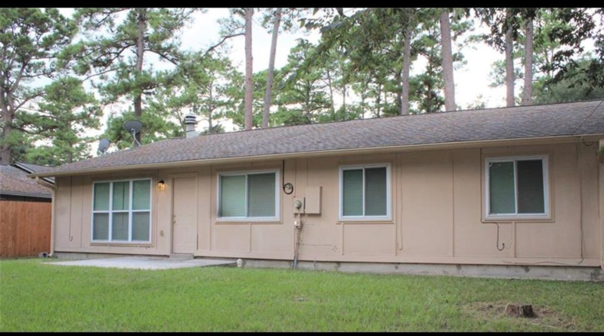 23022 Laketree Lane Spring, TX 77373 - Photo 4 of 42 a front view of a house with a yard
