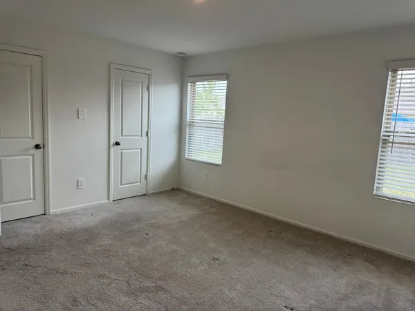 an empty room with windows