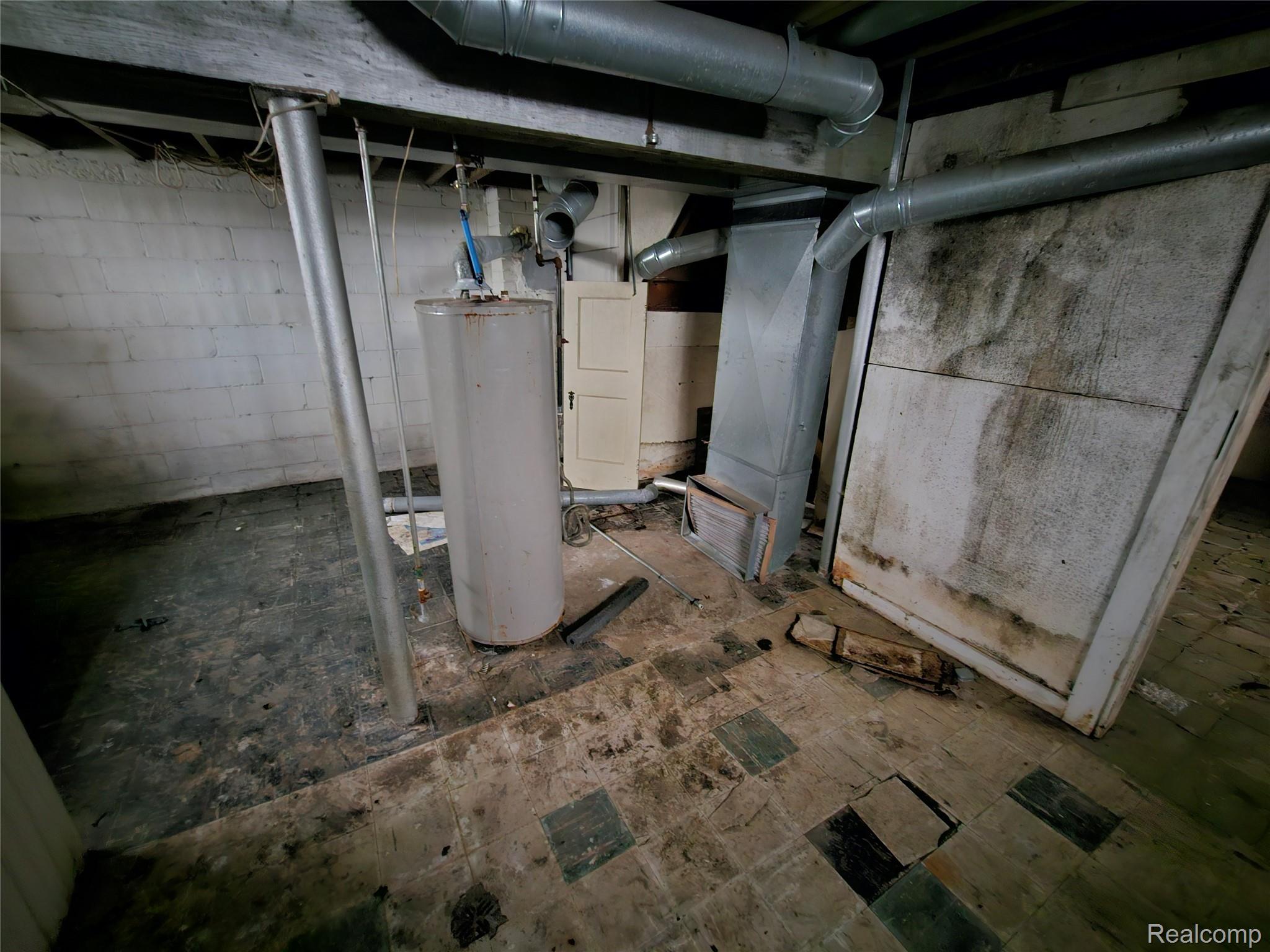 19442 Moross Road Detroit, MI 48224 - Photo 44 of 48 Unfinished basement featuring water heater and heating unit