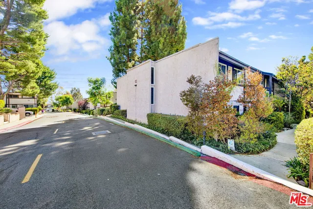 a view of a garden with a pathway