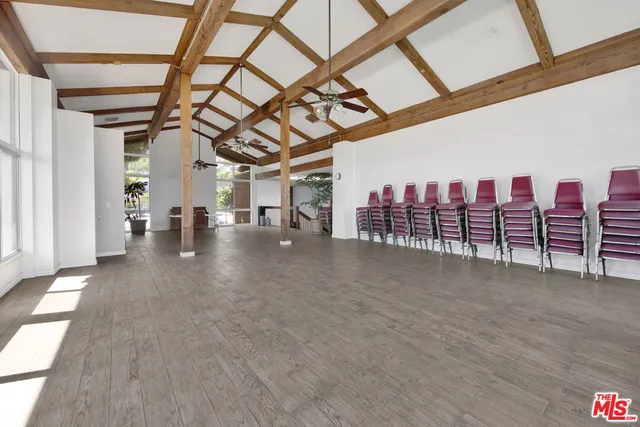 a view of a room with wooden walls