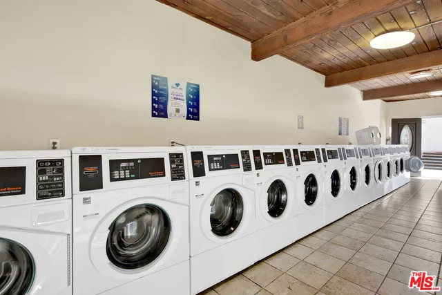 a view of a living room with washer and dryer