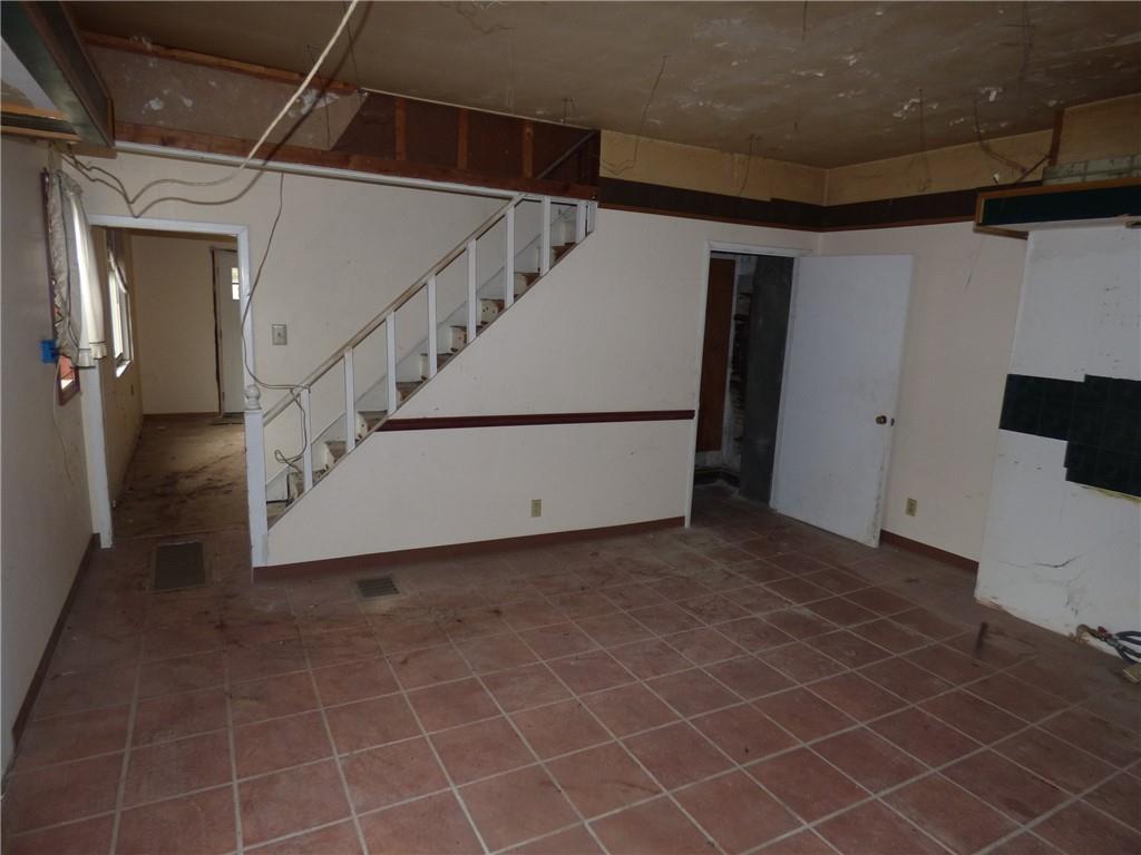 911 Amherst Street Pittsburgh, PA 15220 - Photo 19 of 36 a view of a livingroom with an empty space and staircase