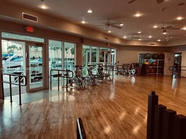 a view of a dining room with furniture wooden floor and chandelier