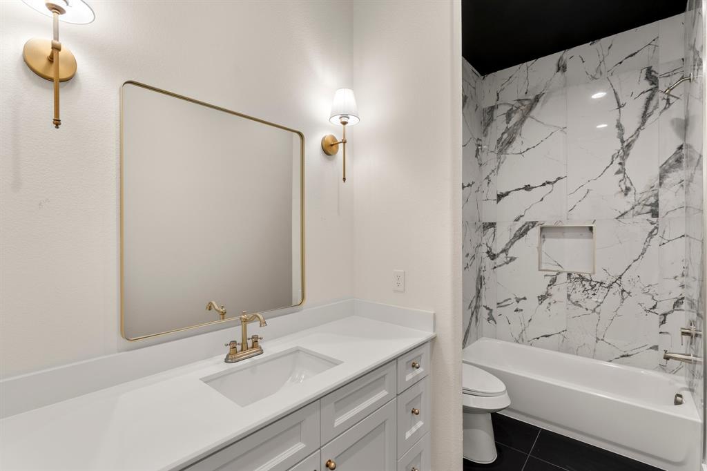 320 Dalton Road Canton, TX 75103 - Photo 20 of 29 Full bath with vanity, shower / bath combination, and dark tile patterned flooring