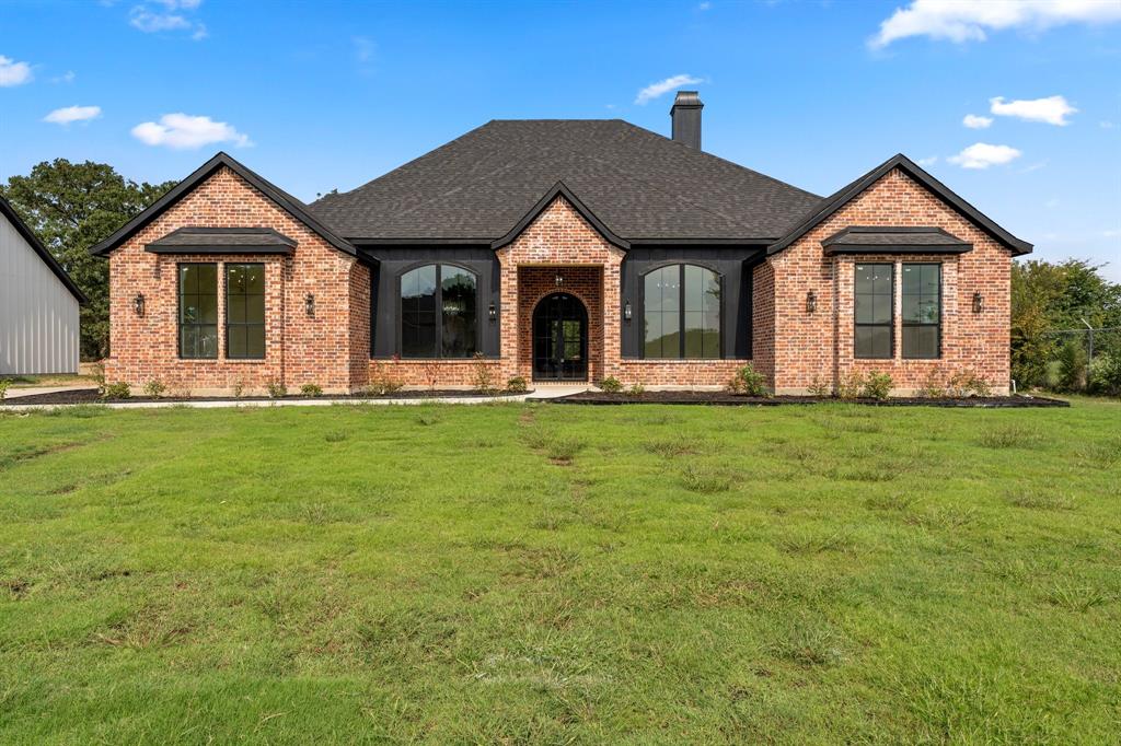 320 Dalton Road Canton, TX 75103 - Photo 3 of 29 French country style house with a front lawn, brick siding, a chimney, and roof with shingles