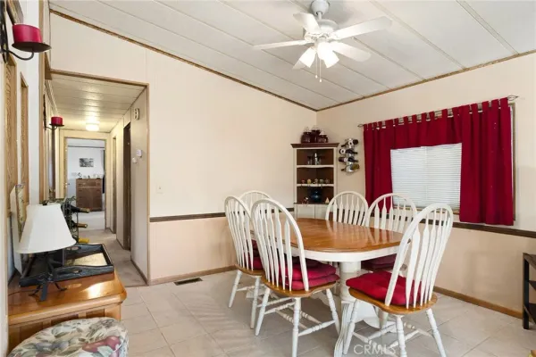 a view of a hallway with wooden shelves