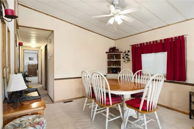 a view of a hallway with wooden shelves