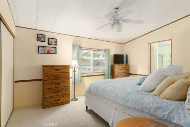 a bathroom with a sink vanity granite and toilet