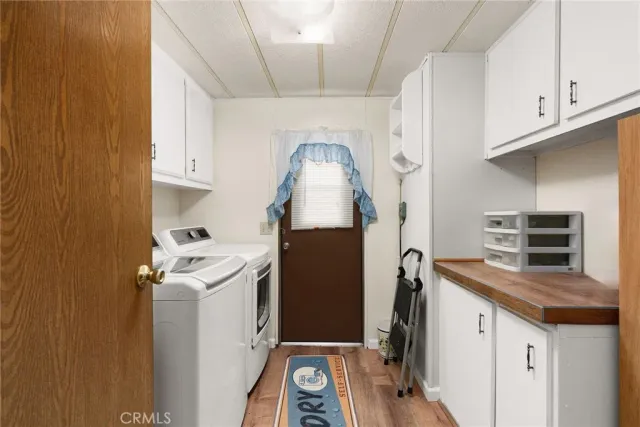 a view of living room with furniture and a potted plant