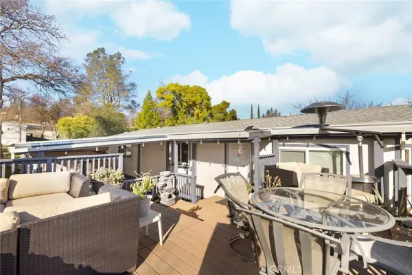 a view of a swimming pool with a yard and plants