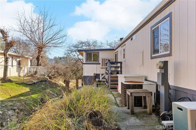 a view of a house with pool and sitting area