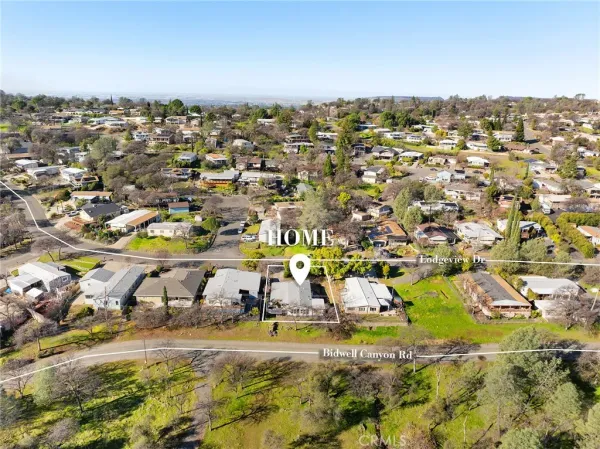 an aerial view of residential houses with outdoor space