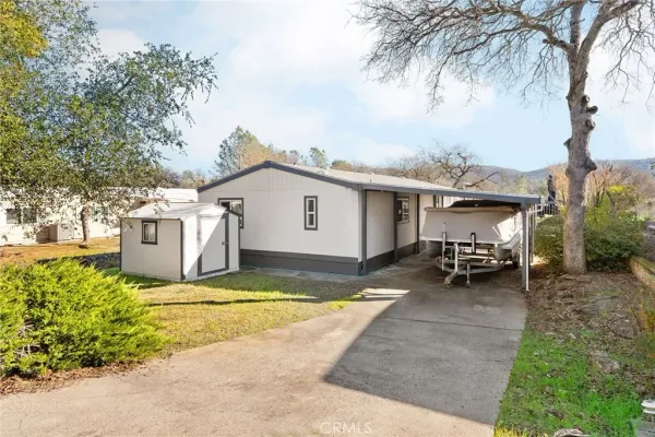 a view of a patio with table and chairs