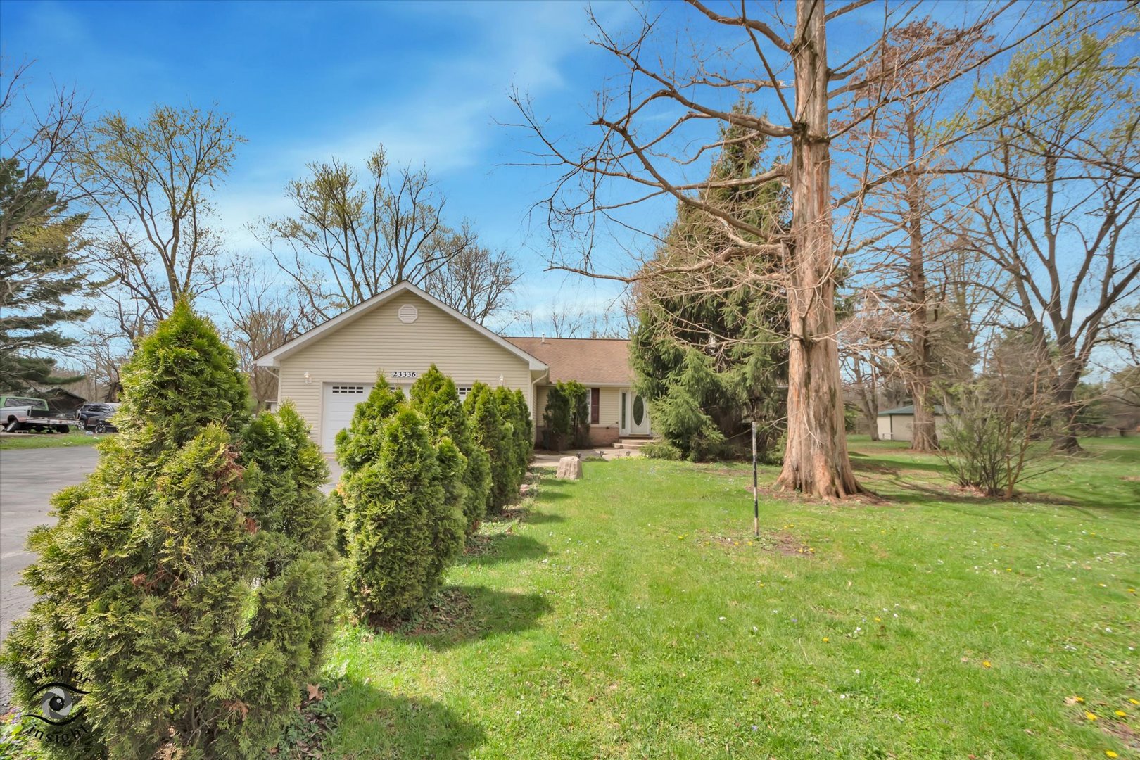 a view of a house with a yard