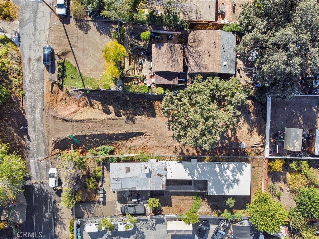 an aerial view of a houses with yard