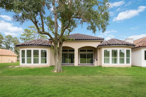 front view of a house with a garden