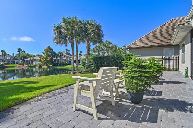a view of a chair and table on the garden