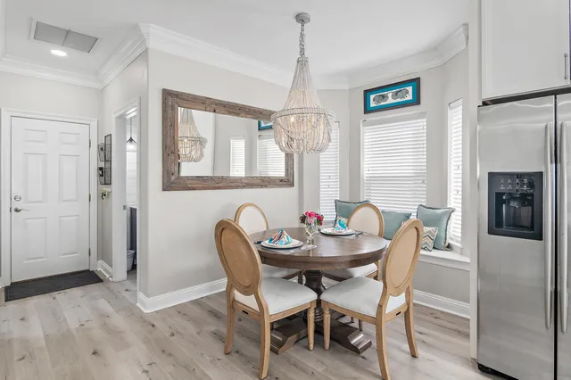 a view of a dining room with furniture and window