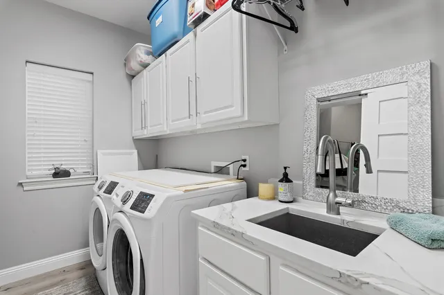 a view of storage and utility room with washer and dryer