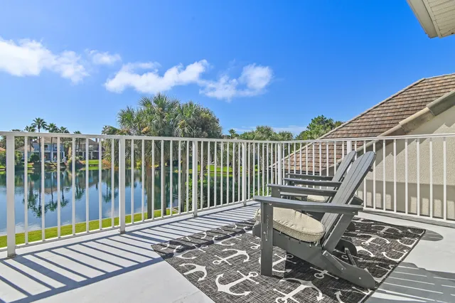 a view of a roof deck with wooden floor and fence