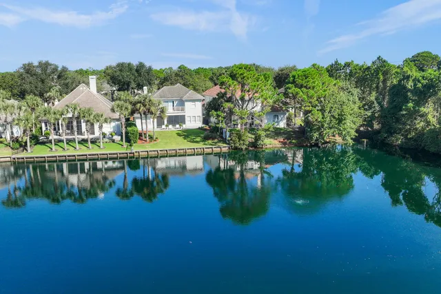 a view of a lake with a house in the background