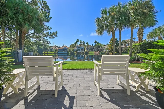 a view of a chairs and table on the patio