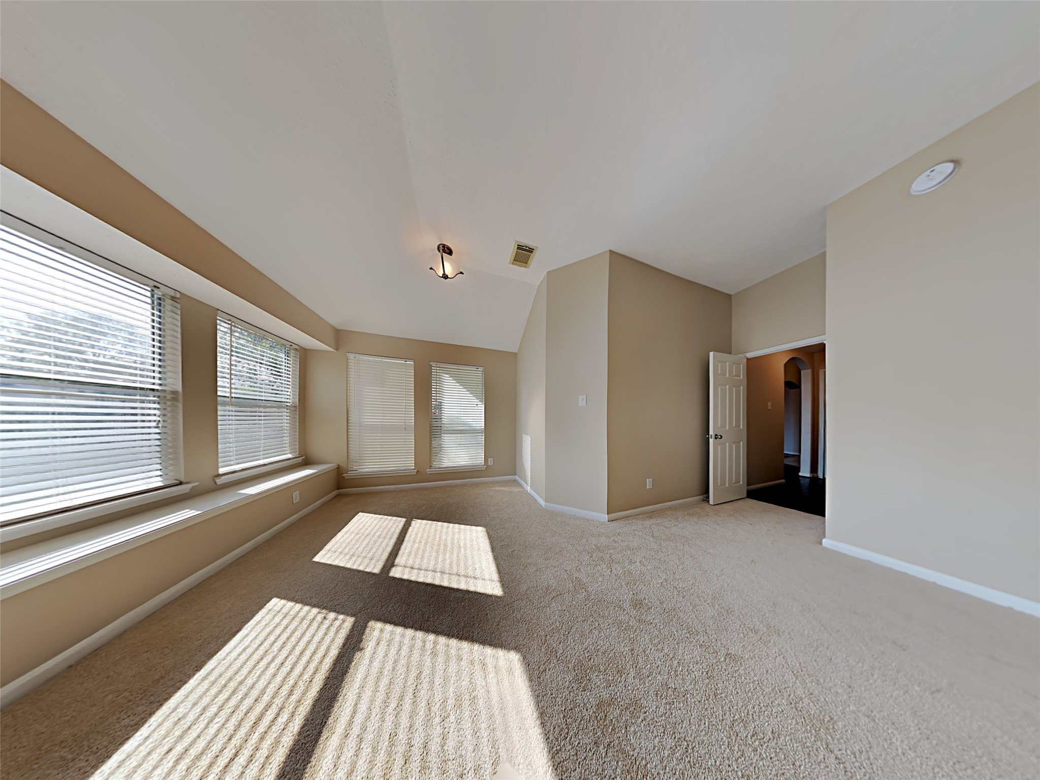 74 Wimberly Way Conroe, TX 77385 - Photo 14 of 18 a view of an empty room with a fireplace and a window