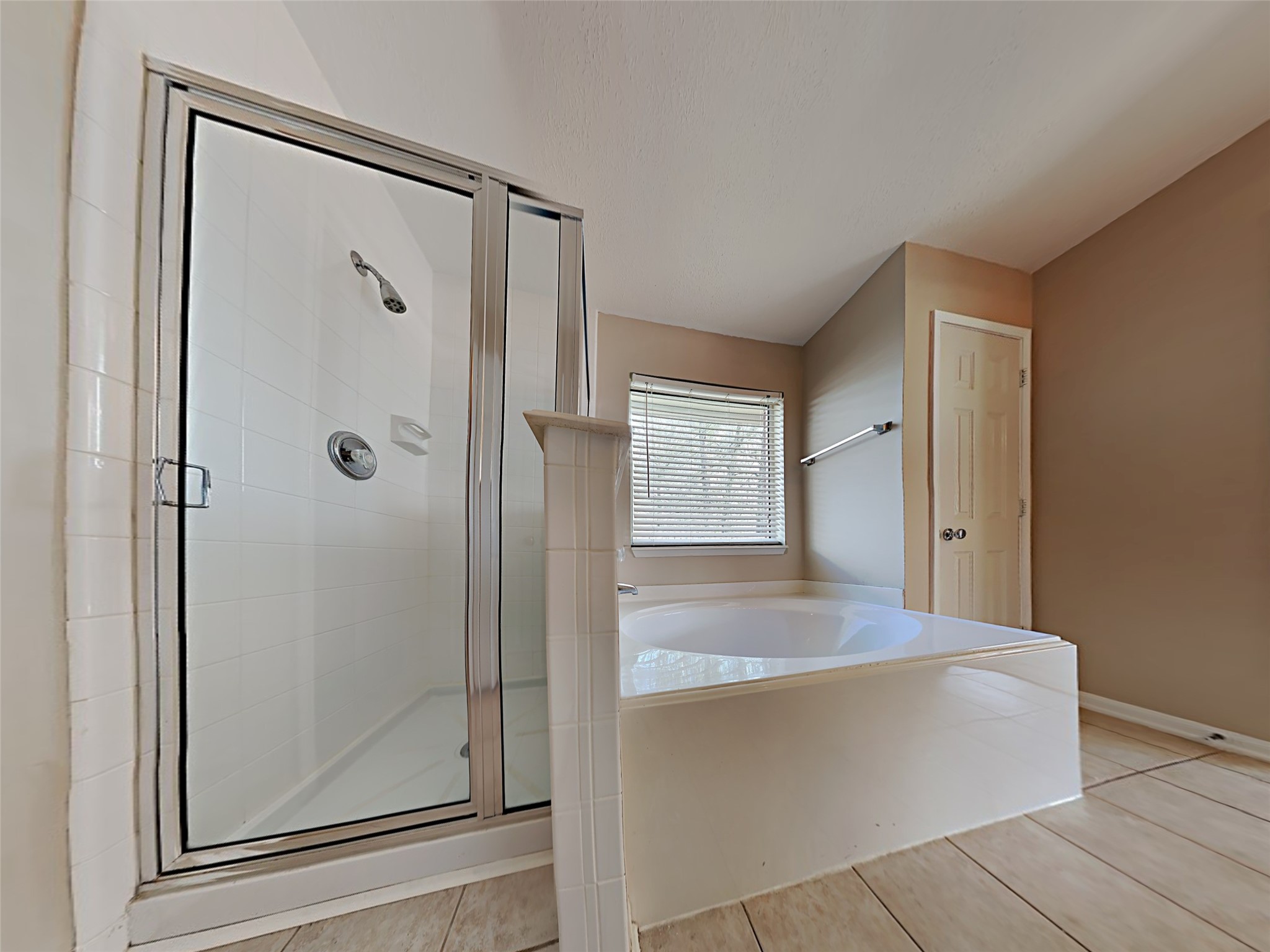 74 Wimberly Way Conroe, TX 77385 - Photo 17 of 18 a view of bathroom with bathtub and shower
