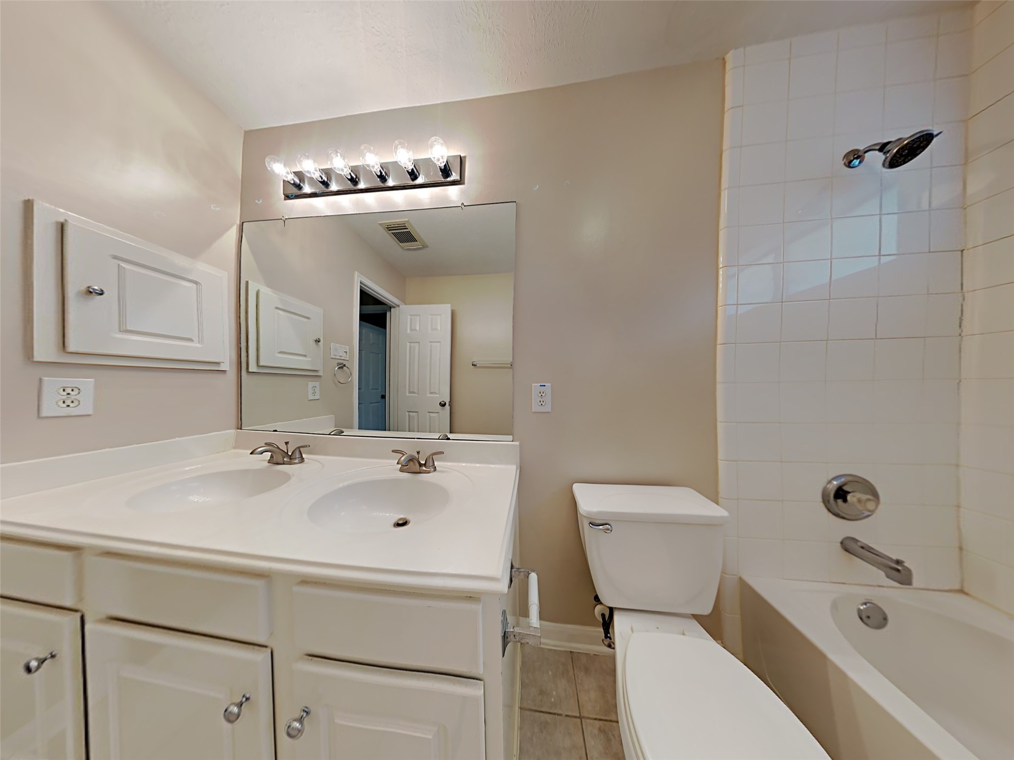 74 Wimberly Way Conroe, TX 77385 - Photo 6 of 18 a bathroom with a sink a toilet and shower