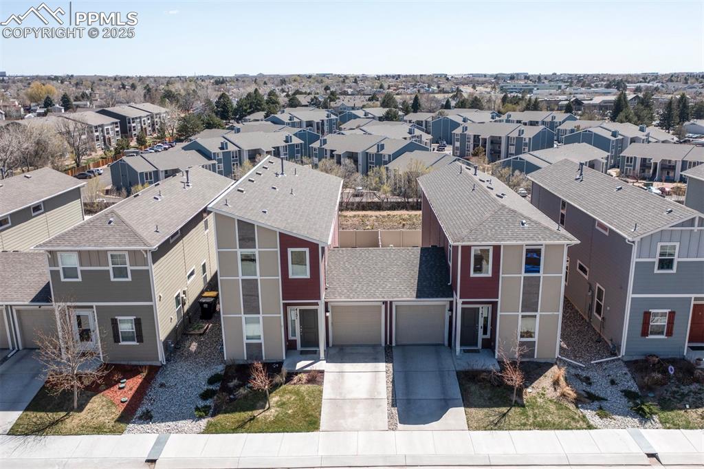 4151 Jericho Loop Colorado Springs, CO 80916 - Photo 3 of 34 an aerial view of a house with a garden