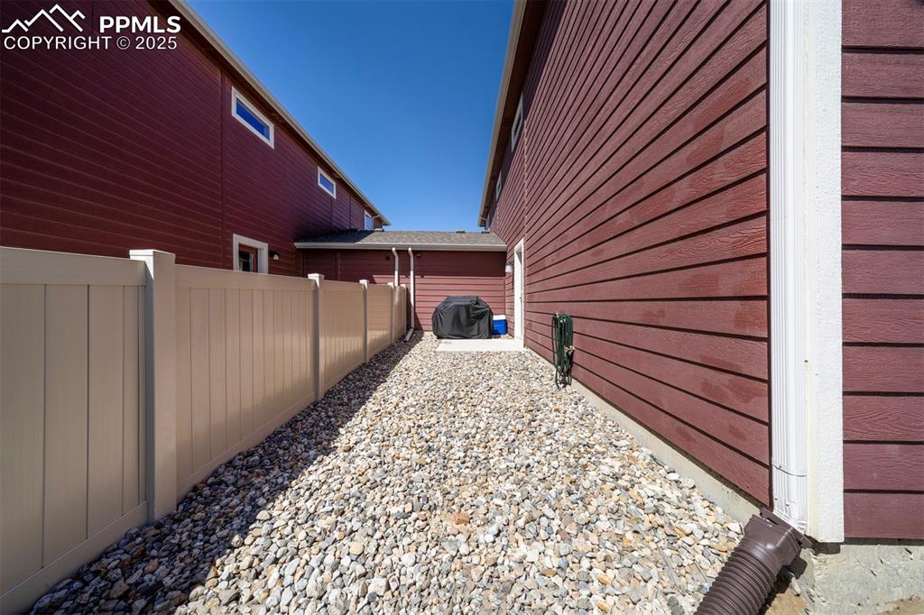 4151 Jericho Loop Colorado Springs, CO 80916 - Photo 34 of 34 a view of a backyard with a garden