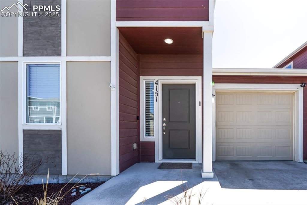 4151 Jericho Loop Colorado Springs, CO 80916 - Photo 4 of 34 a view of livingroom with hardwood floor and hallway