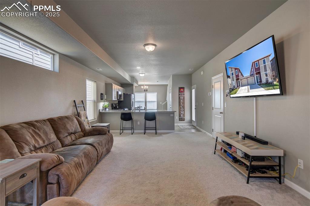 4151 Jericho Loop Colorado Springs, CO 80916 - Photo 7 of 34 a living room with furniture and a couch