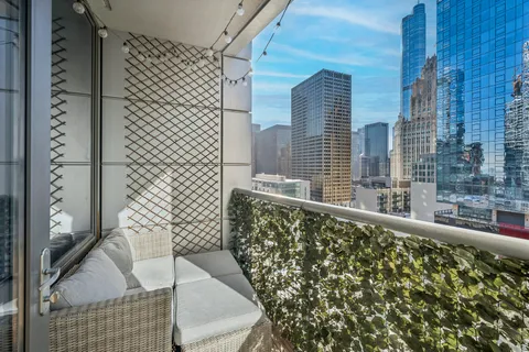 a view of balcony with furniture