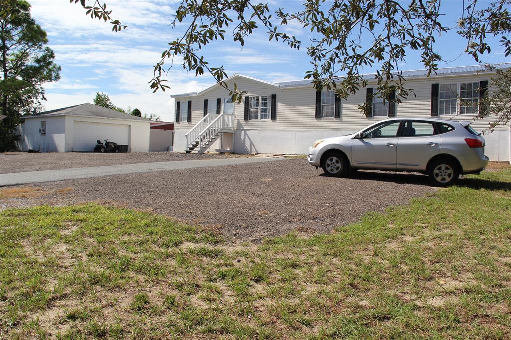 13127 Star Road Brooksville, FL 34613 - Photo 42 of 54 a view of a car park in front of a building