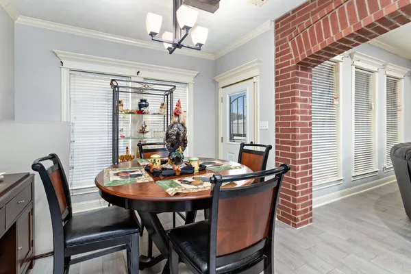a kitchen with a table and chairs in it
