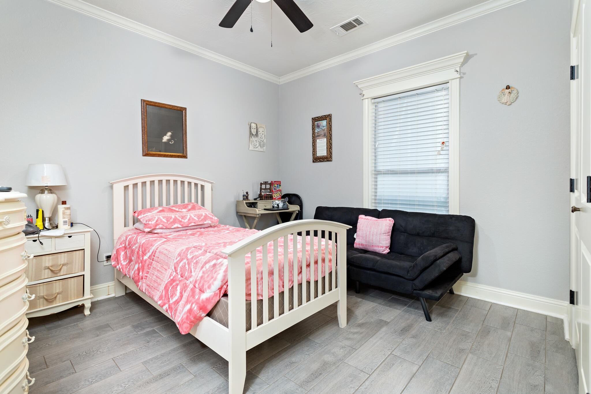3210 Ethan Symone Street Beaumont, TX 77705 - Photo 13 of 33 a bedroom with a bed and a lamp on desk