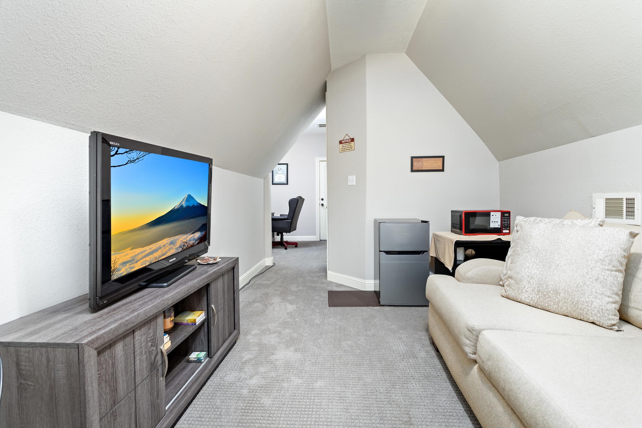 3210 Ethan Symone Street Beaumont, TX 77705 - Photo 24 of 33 a living room with furniture and a flat screen tv