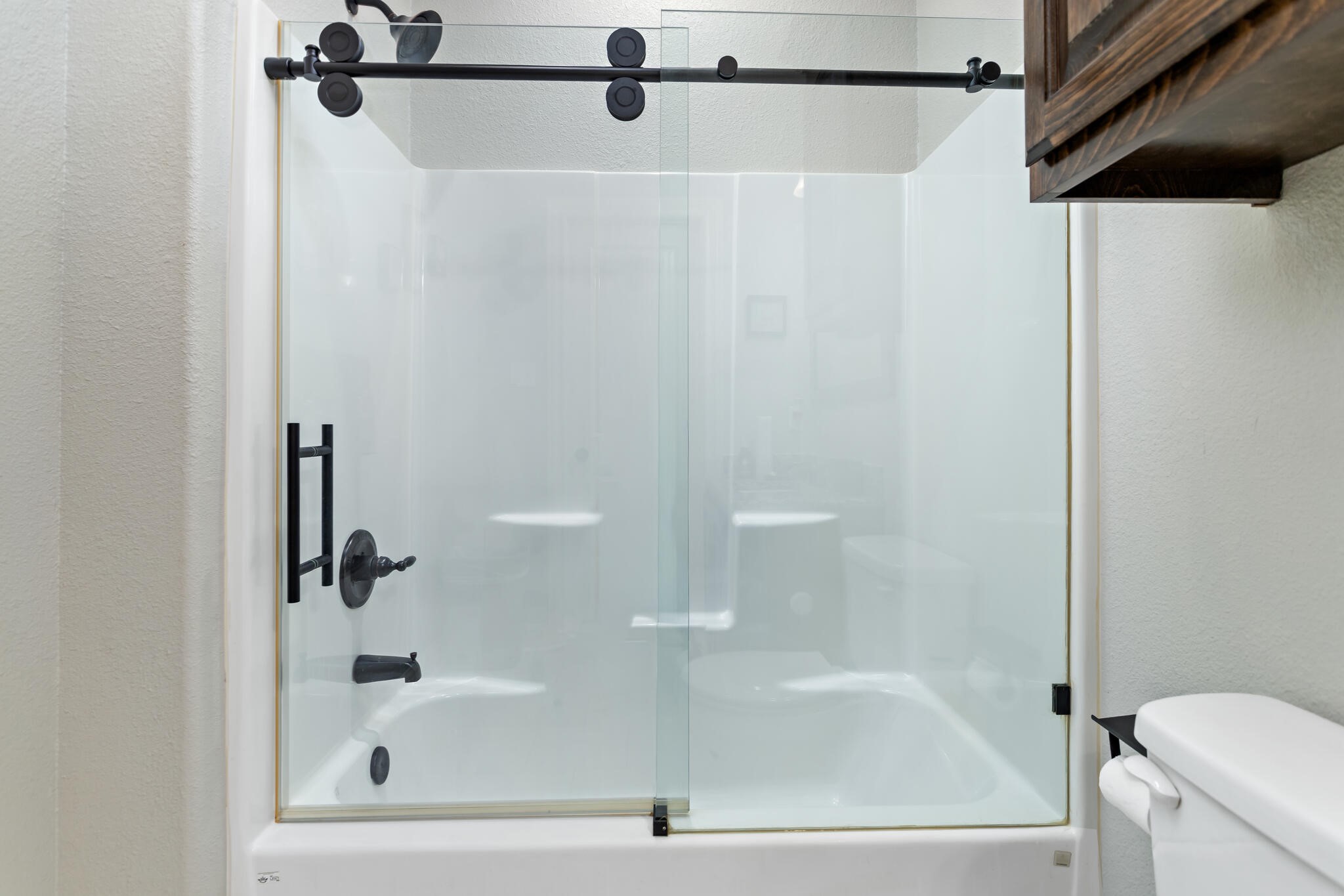 3210 Ethan Symone Street Beaumont, TX 77705 - Photo 27 of 33 a bathroom with a shower and a toilet