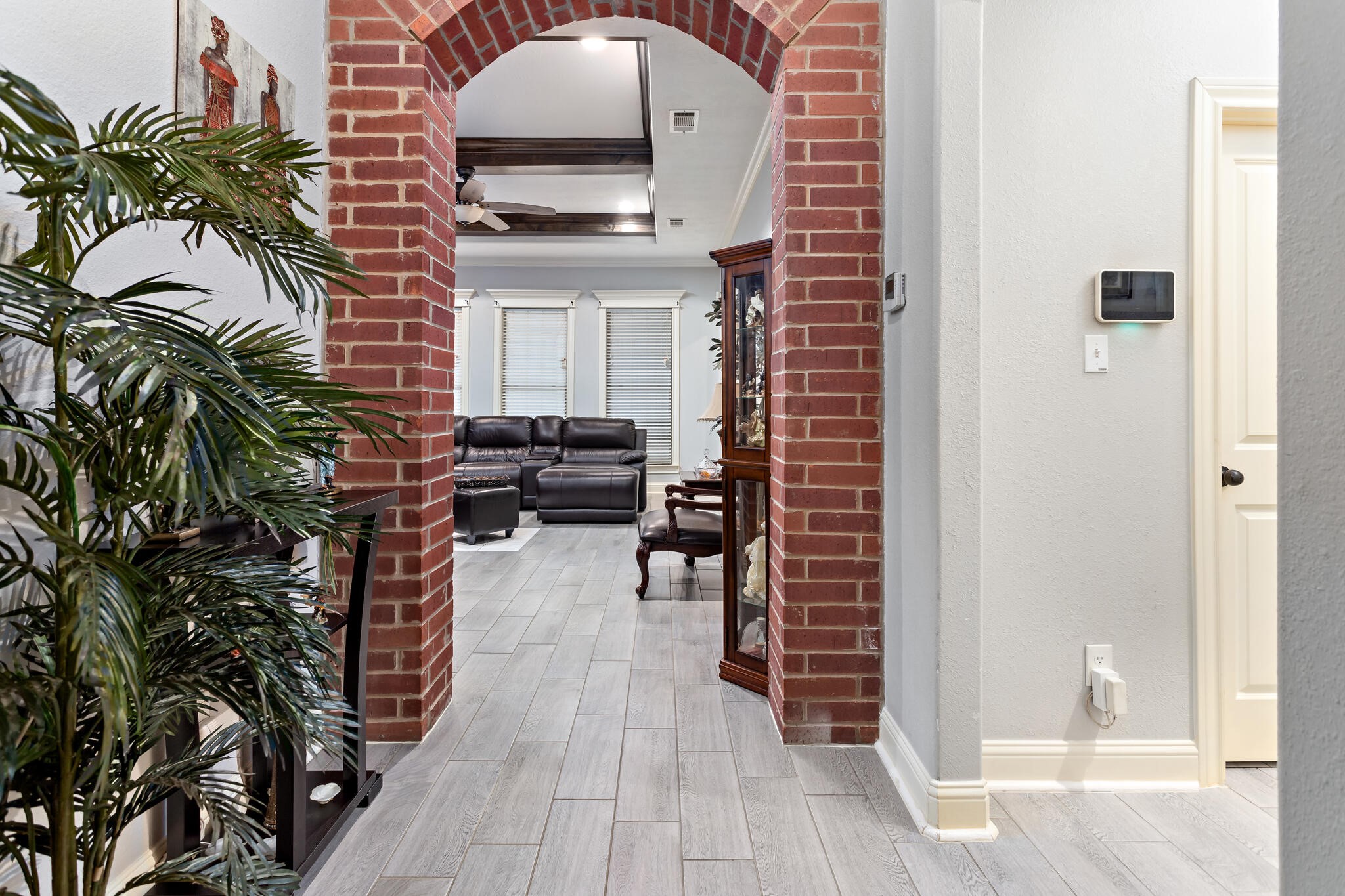 3210 Ethan Symone Street Beaumont, TX 77705 - Photo 6 of 33 a living room with furniture and a potted plant