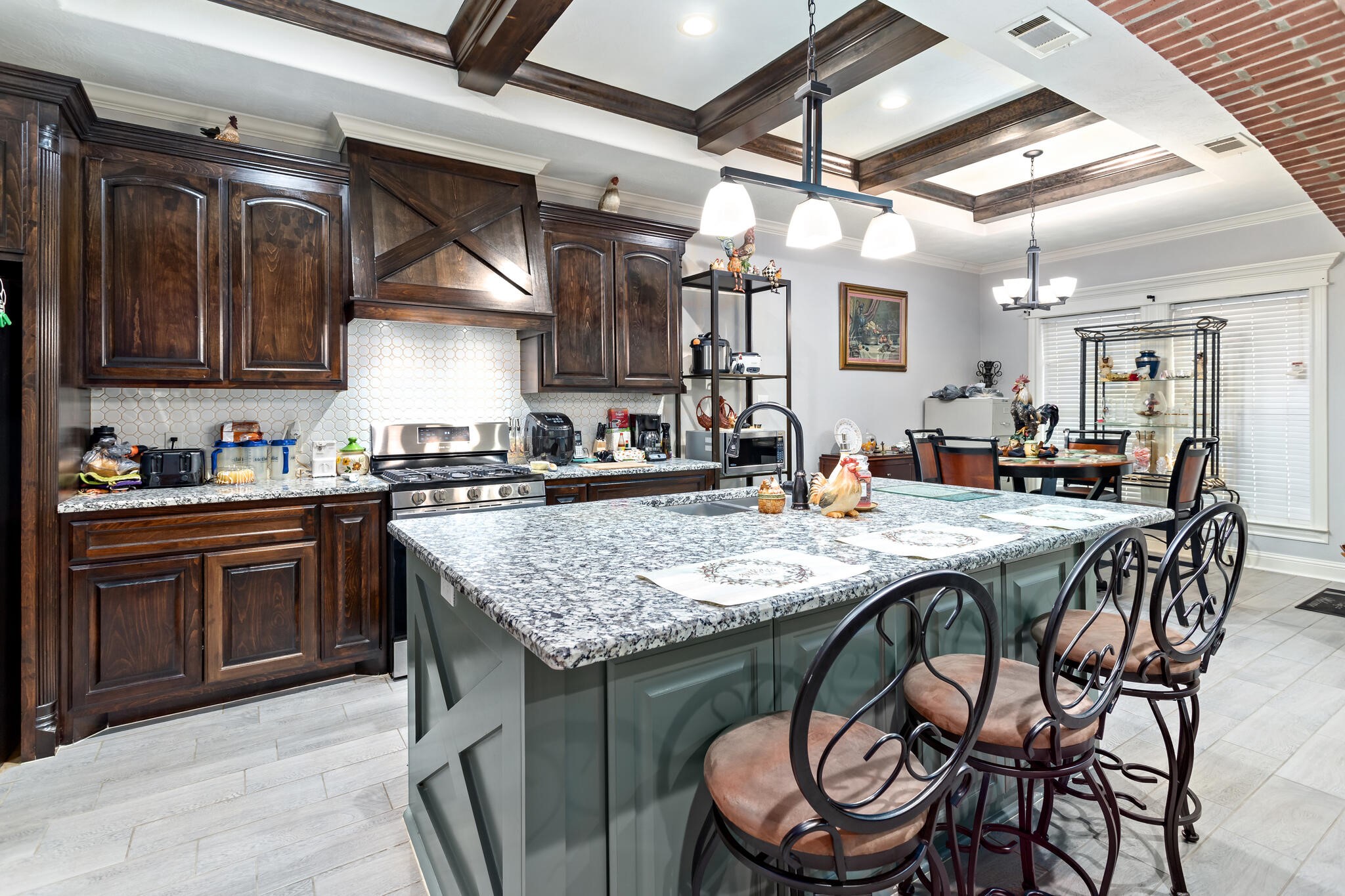 3210 Ethan Symone Street Beaumont, TX 77705 - Photo 10 of 33 a kitchen with a table and chairs in it