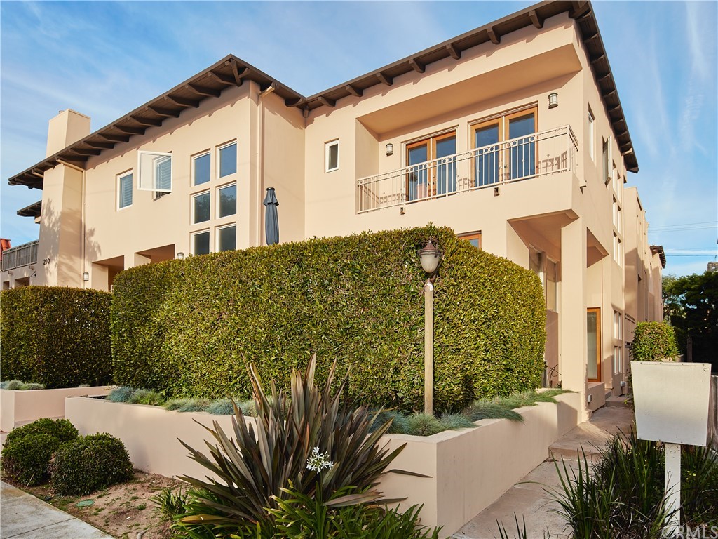 210 Whiting Street, Unit C El Segundo, CA 90245 - Photo 1 of 27 a view of a house with a backyard