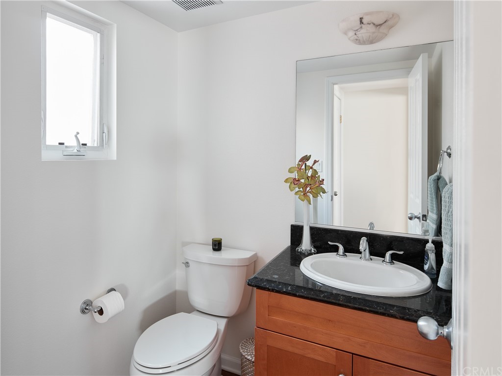 210 Whiting Street, Unit C El Segundo, CA 90245 - Photo 15 of 27 a bathroom with a granite countertop sink and a mirror